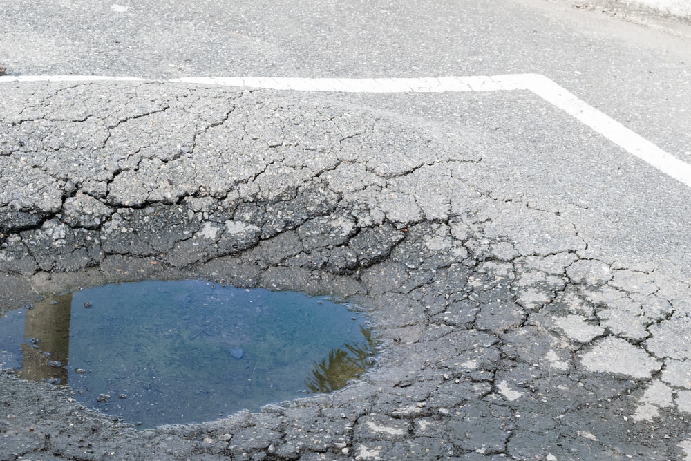 flooded pothole in parking lot