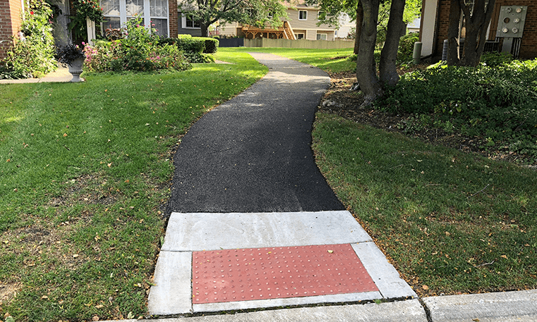 asphalt sidewalk with concrete