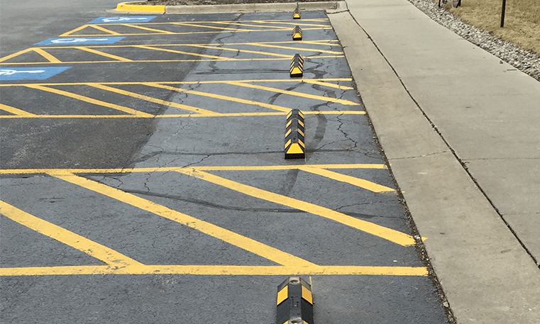 row of bumper blocks in parking lot