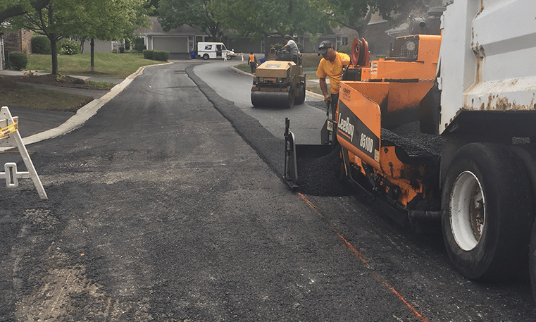 construction workers paving street
