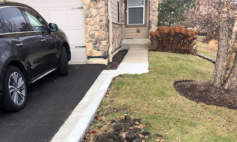 home driveway after asphalt replacement
