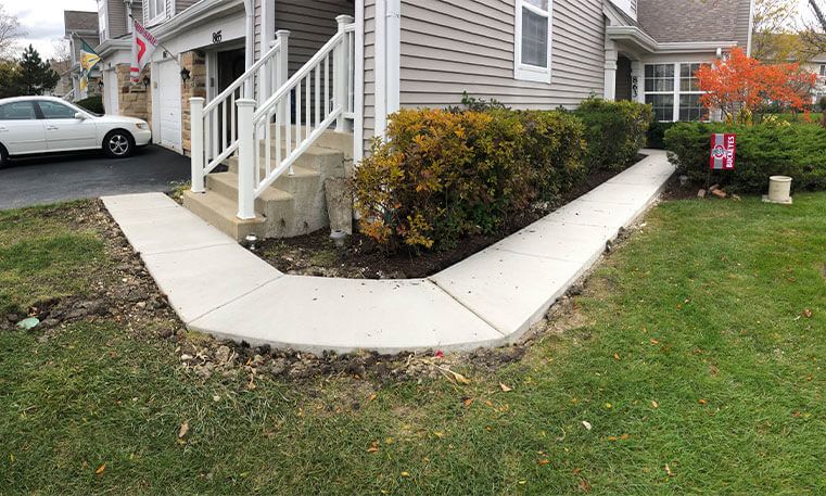 renovated sidewalk wrapping around home