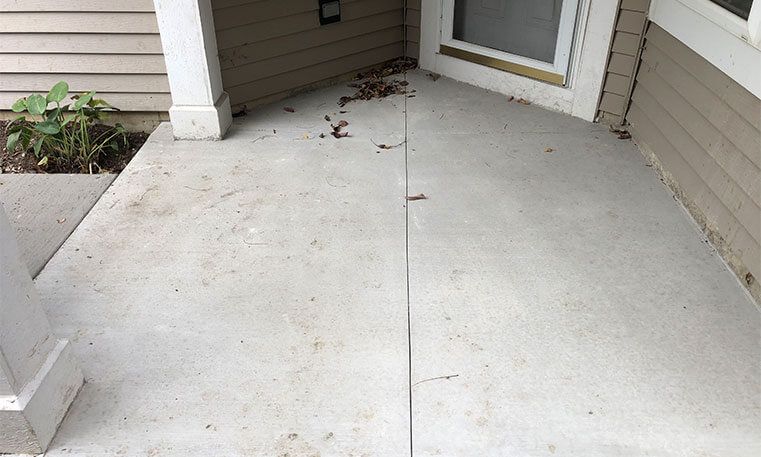 walkway of home with new concrete surface