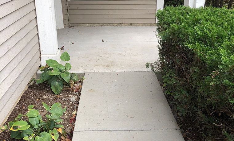 new concrete sidewalk in front of home