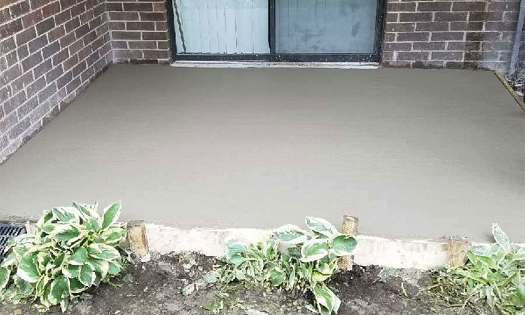 new patio concrete in front of home