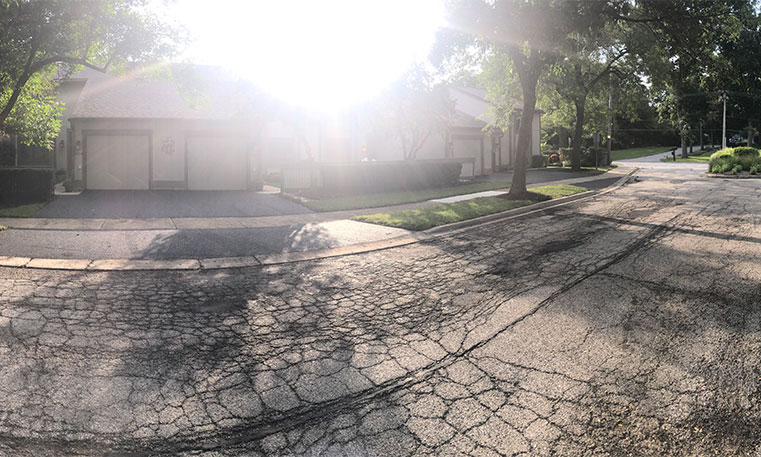 damaged driveway prior to removal and replacement