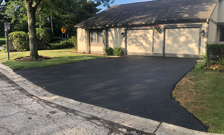 finished asphalt driveway after replacement