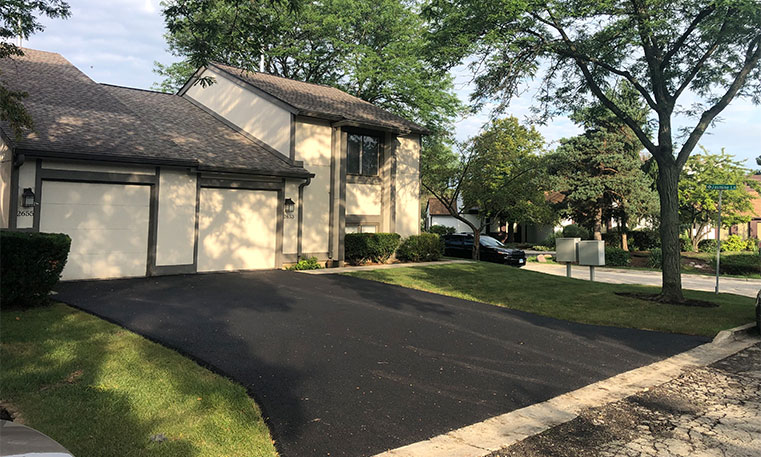 home driveway after asphalt replacement