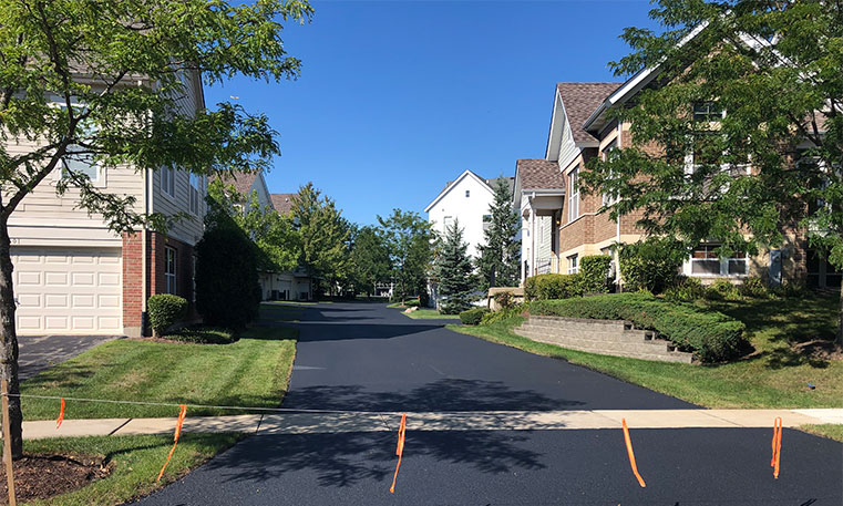 townhome street and driveways after asphalt replacement