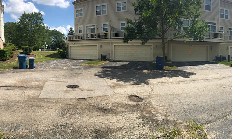 townhome driveway prior to asphalt replacement