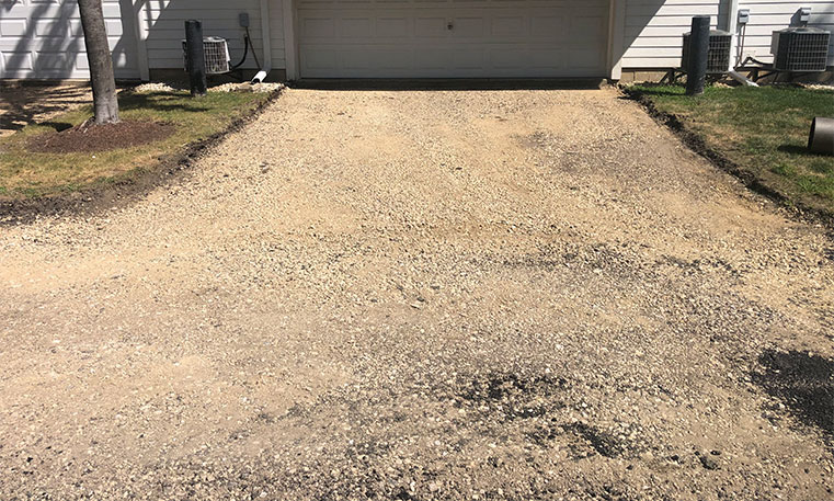 townhome driveway before asphalt replacement