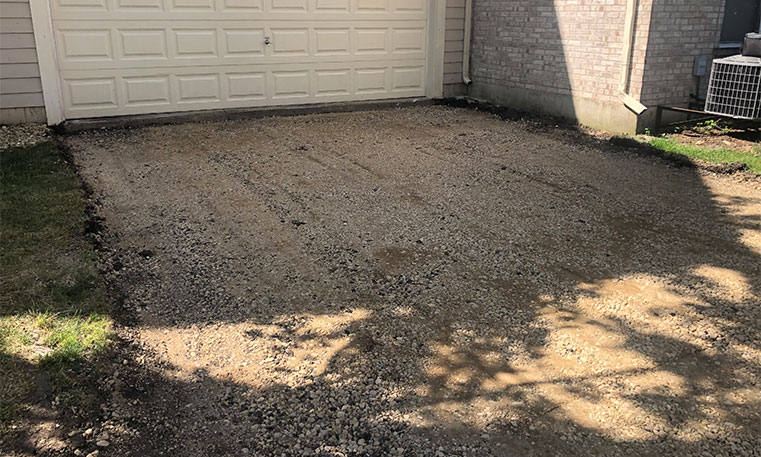 townhome gravel driveway before asphalt replacement