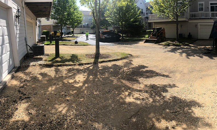 townhome driveway prior to asphalt replacement