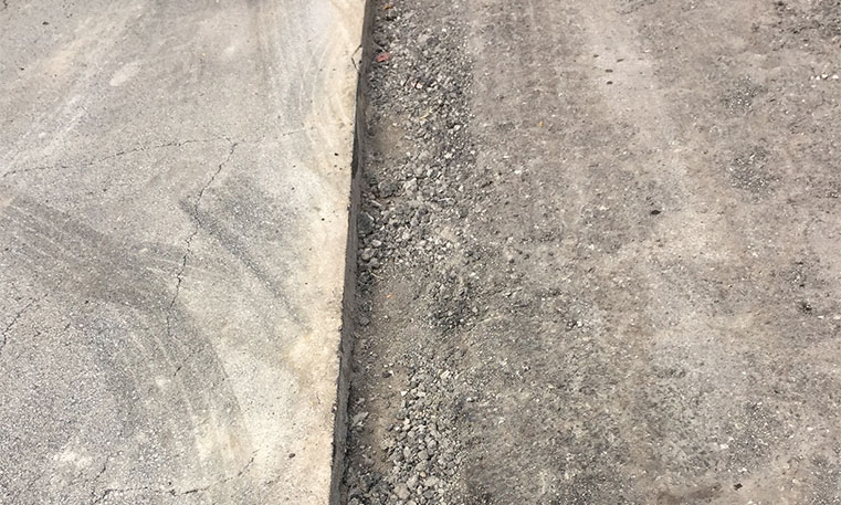 damaged concrete in parking lot