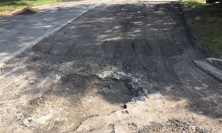 damaged concrete surface in parking lot