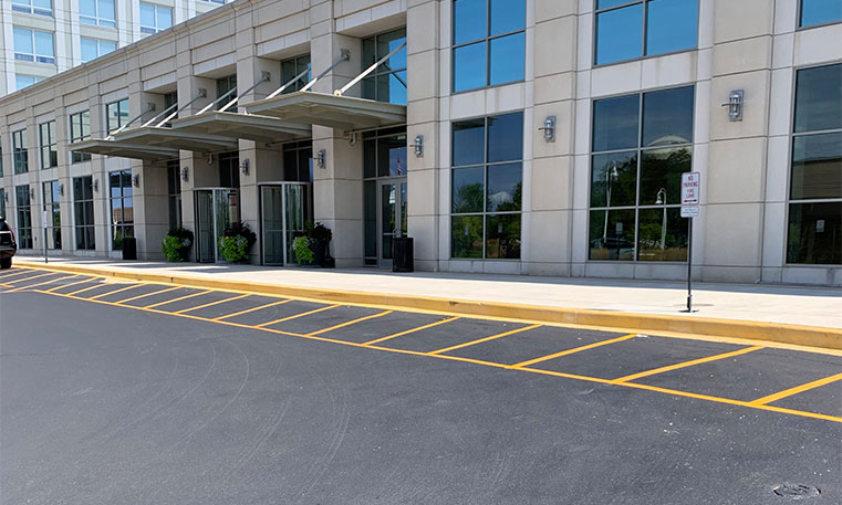 new asphalt and lot markers in hotel parking lot