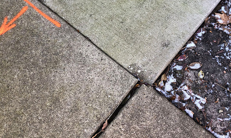 damaged concrete sidewalk