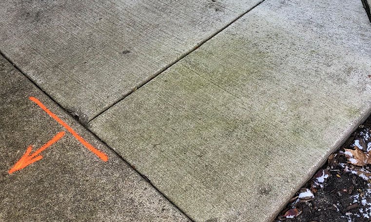 level concrete sidewalk surface