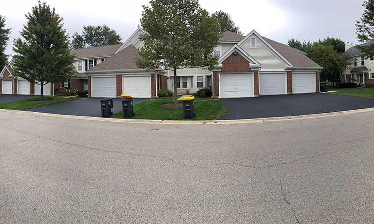 front view of home and driveway with sealcoating