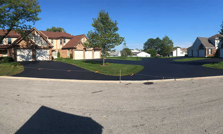 street view of sealcoated home driveway